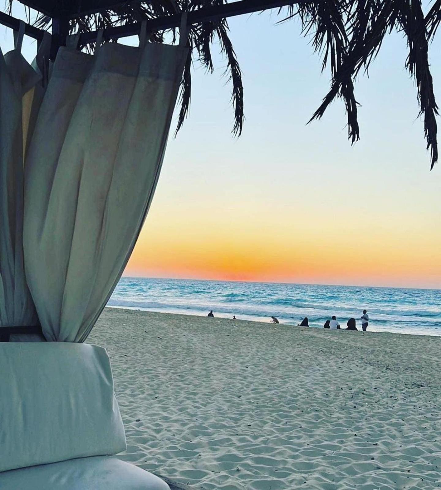Borg El Arab Beach Resort Buitenkant foto Sunset at the beach